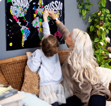 Mother and daughter scratching map